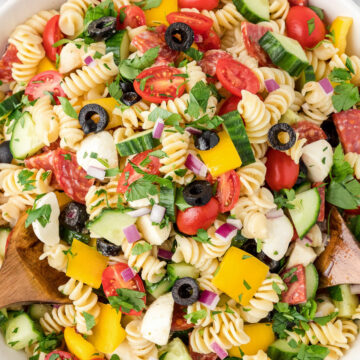 Pasta salad with Italian dressing in a bowl.