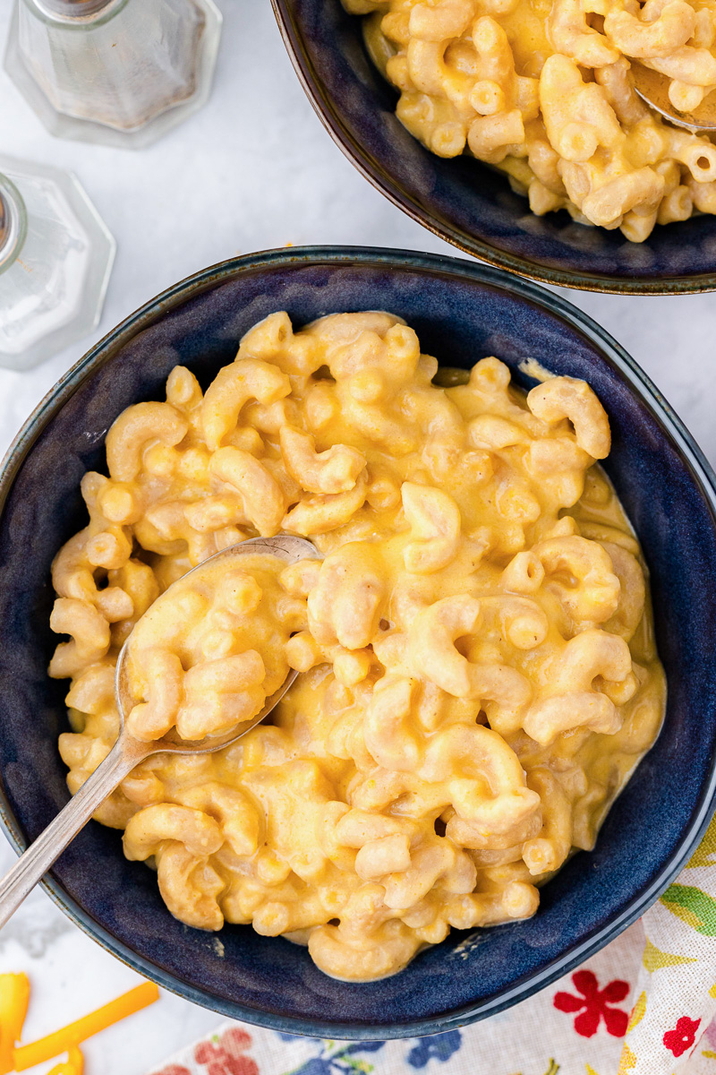 Healthier mac and cheese in blue bowl.