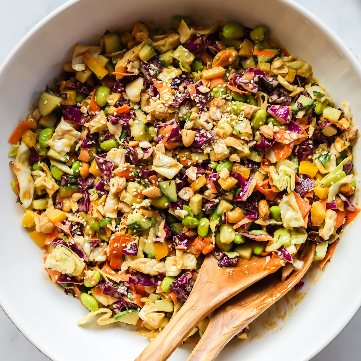 Thai crunch salad in a white bowl.