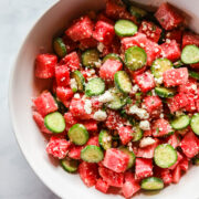 Watermelon salad in white bowl.