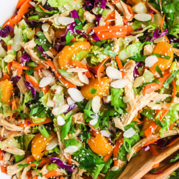 Sesame chicken salad with dressing.